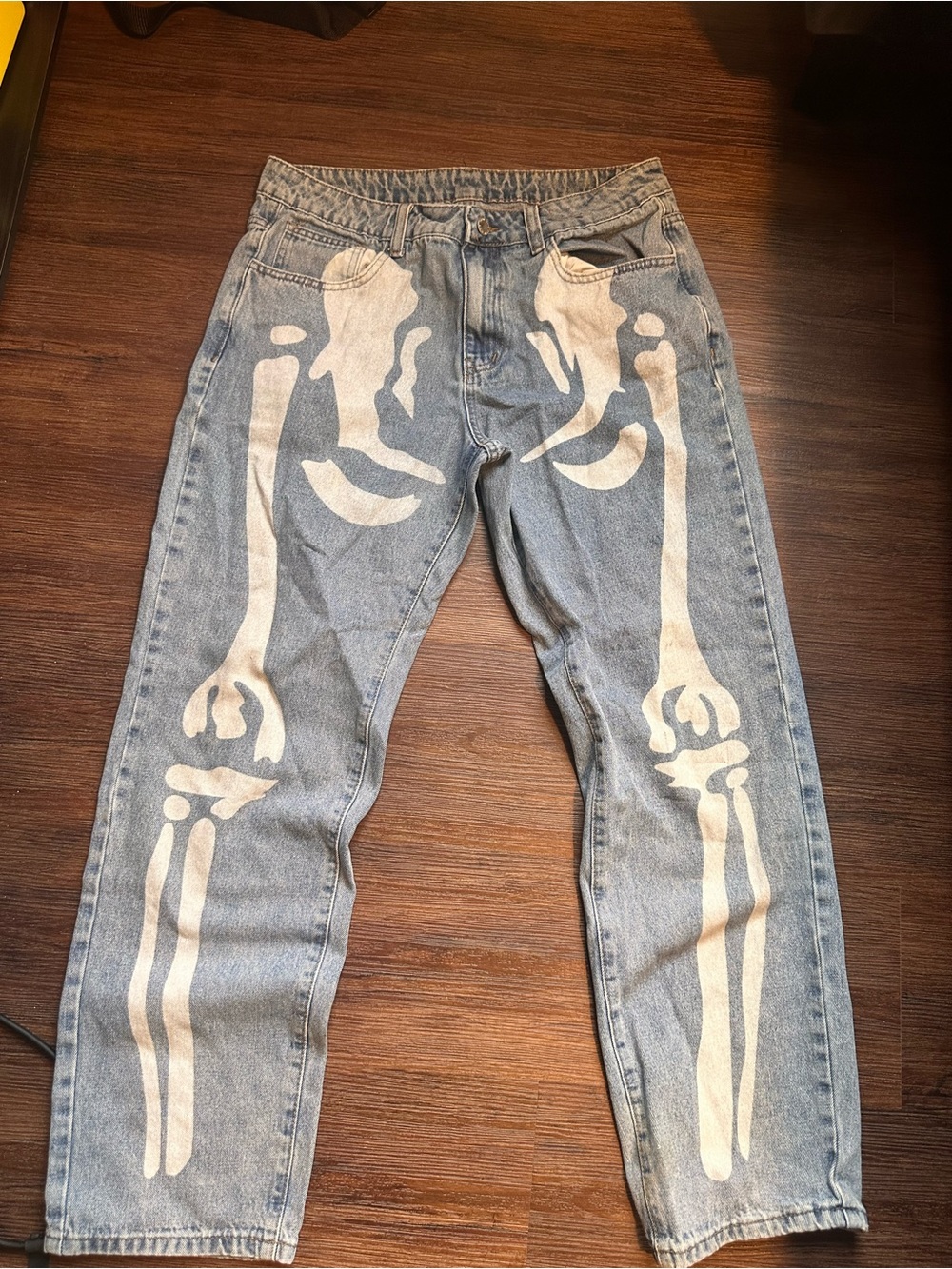SHEIN Light Blue Denim Jeans with White Skeleton Print